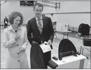  ?? AP/STEVE HELBER ?? Lt. Gov. Ralph Northam of Virginia and his wife, Pam, vote Tuesday at their precinct in Norfolk.