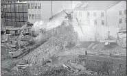  ?? AP/LUCA ZENNARO ?? Workers remove rubble Thursday from the Morandi bridge that collapsed earlier this week in Genoa, Italy.