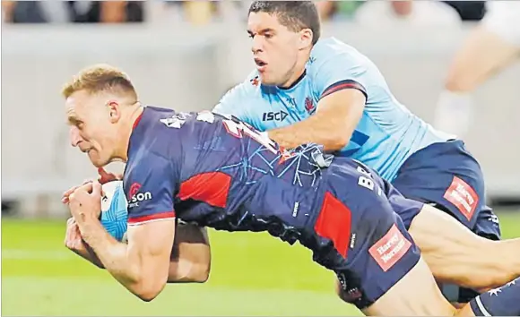  ?? Picture: SUPER RUGBY PACIFIC ?? Rebels’ Reece Hodges dives over for a try against the Waratahs on Friday night.