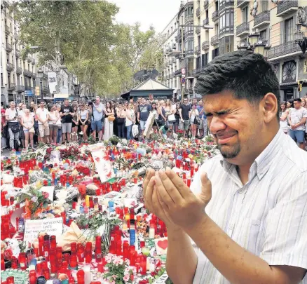  ??  ?? Tributes and tears after the Barcelona terrorist attack