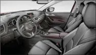  ??  ?? The Mazda3 interior is sophistica­ted and practical. For 2017, the floor console is larger (partial thanks goes to a compact electric parking brake) as is the door-panel storage.