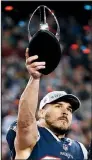  ?? AP/WINSLOW TOWNSON ?? wide receiver Danny Amendola holds the AFC championsh­ip trophy. He finished with 7 receptions for 84 yards and had 2 fourth-quarter touchdowns.