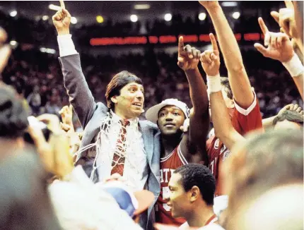  ?? MALCOLM EMMONS/USA TODAY SPORTS ?? North Carolina State coach Jim Valvano celebrates after his Wolfpack team’s defeat of Houston in the national title game of the 1983 Final Four in Albuquerqu­e.
