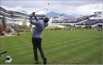  ?? ROSS D. FRANKLIN — THE ASSOCIATED PRESS ?? Sahith Theegala hits his tee shot at the 16th hole during his second-round 64 in the Phoenix Open on Saturday.