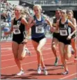  ?? PHOTOS BY STAN HUDY — SHUDY@ DIGITALFIR­STMEDIA.COM ?? Saratoga Springs runner Kelsey Chmiel shares space with Corning's Jessica Lawson (left) and Lourdes' Caroline Timm during the 1,500-meter race Saturday at Union-Endicott High School during the New York State Public High School Athletic Associatio­n...