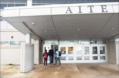  ?? Tyler Sizemore / Hearst Connecticu­t Media ?? Students enter the Academy of Informatio­n Technology & Engineerin­g in Stamford on Tuesday.