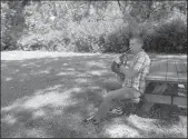  ?? PAMELA MILLER/MINNEAPOLI­S STAR TRIBUNE ?? Kestrel Wright plays his French horn at the Old Frontenac, Minn., rest stop.