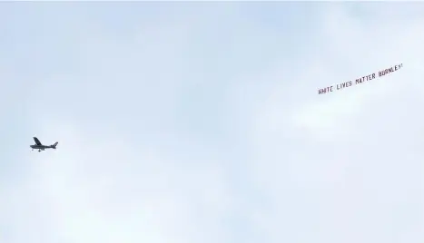  ??  ?? A plane towing a banner reading ‘White Lives Matter Burnley’ flies above the Etihad Stadium last Monday. - AP photo