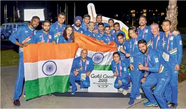  ?? — PTI ?? Members of the Indian contingent at the country’s flag-hoisting ceremony in Gold Coast on Monday.