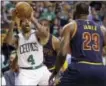  ?? THE ASSOCIATED PRESS FILE PHOTO ?? Celtics guard Isaiah Thomas (4) prepares to shoot as LeBron James defends.