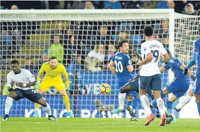  ?? Picture: Getty. ?? Riyad Mahrez fires home Leicester’s second goal in their 2-1 Premier League victory over Tottenham Hotspur at the King Power Stadium.