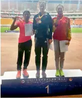  ??  ?? Sprinter Dutee Chand (left) poses with her silver medal at the podium alongside the gold and bronze medallists at the Asian Grand Prix Athletics Meet in Jiaxing, China, on Thursday.