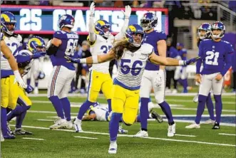  ?? Adam Hunger Associated Press ?? RAMS LINEBACKER Christian Rozeboom (56) rejoices after Giants kicker Mason Crosby missed a potential winning field goal in the final seconds. Crosby also missed an earlier extra-point attempt.