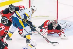  ?? USA TODAY SPORTS ?? Devils goalie Cory Schneider, right, made 33 saves against the Predators.