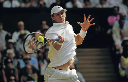  ?? Picture: Reuters ?? South Africa's long-distance tennis player Kevin Anderson whips in a forehand during his semifinal match at Wimbledon on Friday against John Isner of the US.