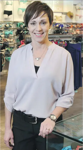  ?? DAVID MOLL/ CALGARY HERALD ?? Swimco owner Lori Bacon was at her 17th Avenue location as she celebrated the company’s 40th anniversar­y. The Calgary-based swimwear retailer is contemplat­ing expansion.