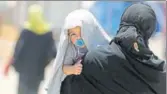  ??  ?? An Iraqi woman with a child at the AlKhazir camp.