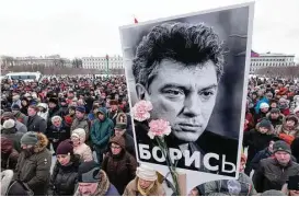  ?? Dmitry Lovetsky / Associated Press ?? Two years after the death of opposition leader Boris Nemtsovin, thousands joined a march in St. Petersburg, Russia, to mark his death.