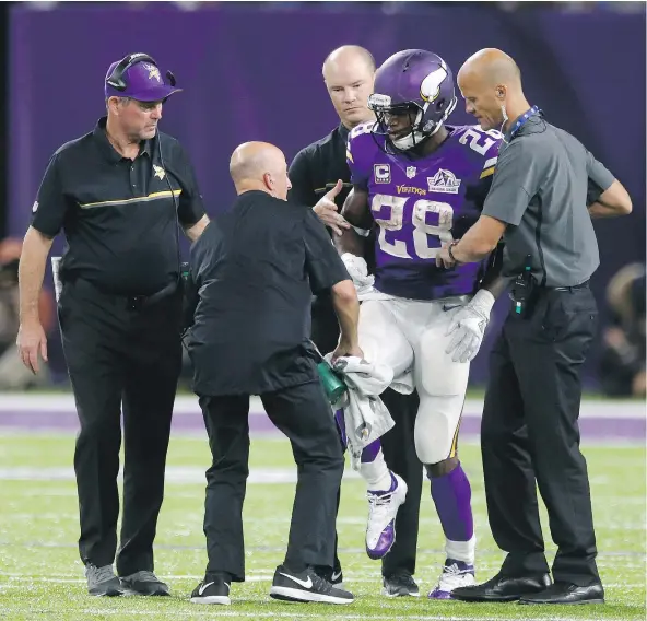  ?? — THE ASSOCIATED PRESS FILES ?? Minnesota Vikings head coach Mike Zimmer says running back Adrian Peterson is “probably ahead of schedule” in his recovery from surgery on his right knee to repair a torn meniscus, which he suffered in a game against the Green Bay Packers in Week 2.