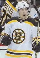  ?? AP PHOTO ?? MIXED RESULTS: Brad Marchand scored a goal and failed to convert a penalty shot during the Bruins’ 6-5 loss last night.