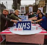  ??  ?? One the table? Protesters in London last month