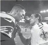  ?? GETTY FILE PHOTO ?? Tom Brady and Drew Brees talk after a 2013 game at Gillette Stadium.
