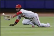  ?? FRANK FRANKLIN II — THE ASSOCIATED PRESS ?? Philadelph­ia Phillies center fielder Odubel Herrera catches a ball hit by New York Mets’ Curtis Granderson for the final out of a baseball game Thursday in New York. The Phillies won 6-4.