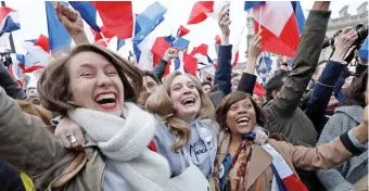  ??  ?? Jubilation: Supporters of Macron at the Louvre victory party yesterday