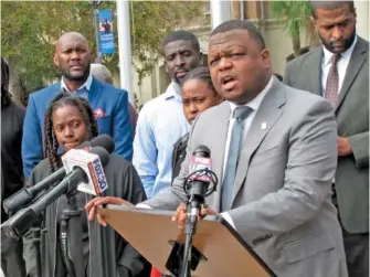  ?? AP PHOTO/RUSS BYNUM ?? Attorney Harry Daniels speaks during a news conference Wednesday in Woodbine, Ga., calling for the firing and arrests of Camden County sheriff’s deputies recorded by security cameras repeatedly punching jail detainee Jarrett Hobbs.