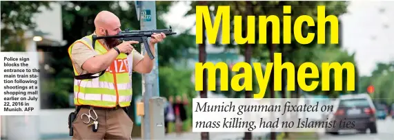  ??  ?? Police sign blocks the entrance to the main train station following shootings at a shopping mall earlier on July 22, 2016 in Munich. AFP