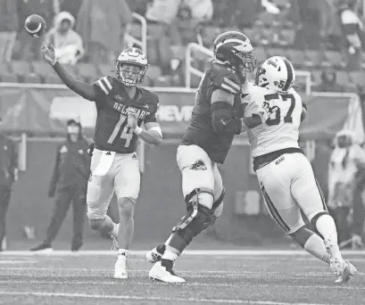  ?? WILLIAM BRETZGER/DELAWARE NEWS JOURNAL ?? Delaware quarterbac­k Ryan O’Connor throws in front of protection from Blaise Sparks against North Carolina A&T’s Anthony Hairston II in the second quarter of the Blue Hens’ 21-6 win last Oct. 14 at Delaware Stadium.