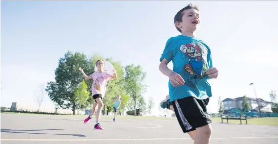  ?? KAYLE NEIS ?? Oliver Van Loon, right, and Ava Bunthey are some of the young athletes doing swimming, cycling, and running drills in preparatio­n for the Kids of Steel triathlon.