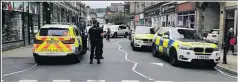  ??  ?? Armed police on Church Street following the incident