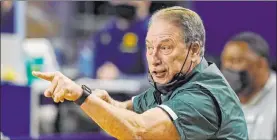  ?? Carlos Osorio The Associated Press ?? Michigan State coach Tom Izzo and his team are in the First Four, something they’ve never experience­d. The Spartans take on UCLA in a battle of East No. 11 seeds.
