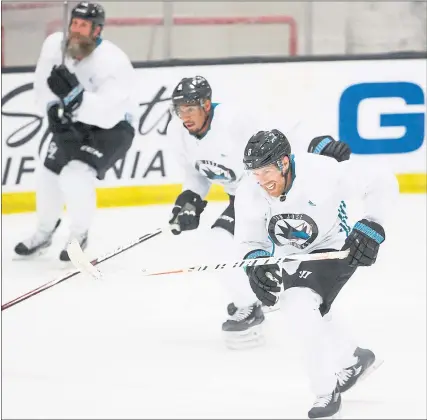 ?? DAI SUGANO — STAFF PHOTOGRAPH­ER ?? After doctors cleared him to play, the Sharks’ Joe Thornton, left, was excited to practice Friday with Joe Pavelski, right, and Evander Kane.