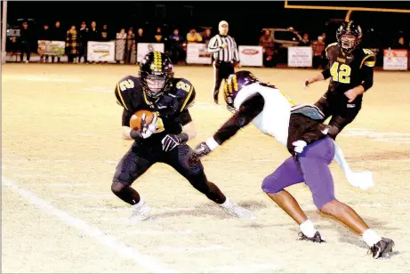  ?? PHOTO BY SHELLEY WILLIAMS ?? Issac Disney tries to juke an Ashdown defender during Friday night’s playoff game in Prairie Grove.