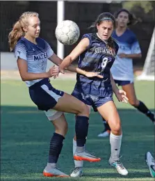  ?? Katharine Lotze/The Signal (See additional photos at signalscv.com) ?? The Master’s Univeristy’s Sydney Robinson (2) fights for the ball with Sierra Nevada’s Annie Clements (8) during a soccer game at the Master’s University on Thursday.