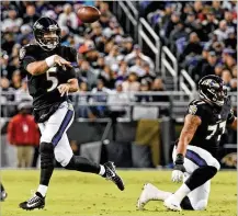  ?? KENNETH K. LAM / BALTIMORE SUN ?? Baltimore QB Joe Flacco has fallen short of 300 yards passing in 18 straight games, but he’s taking better care of the ball lately with just two intercepti­ons in his last six games.