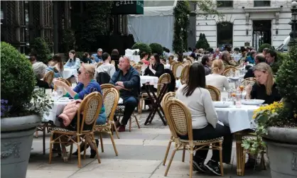  ?? Photograph: Spencer Platt/Getty Images ?? People dine outside in New York City on 4 May.
