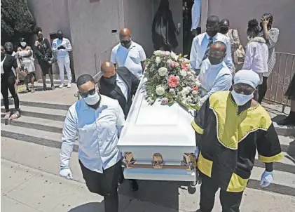  ?? MARCIO JOSE SANCHEZ/AP ?? Pallbearer­s carry the casket of Lydia Nunez after a funeral service last month at the Metropolit­an Baptist Church in Los Angeles.