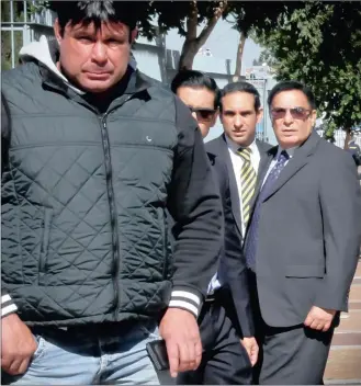 ?? PICTURE: MOTSHWARI MOFOKENG ?? OUTSIDE COURT: Joburg businessma­n and a property mogul Sayed Mia, right, before leaving the Johannesbu­rg Magistrate’s Court with his two sons and a bodyguard after his case was postponed yesterday.