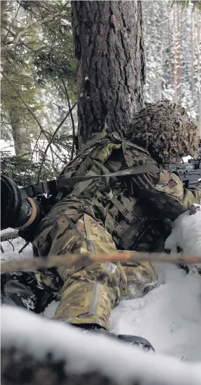  ??  ?? > A soldier from 1st Battalion The Royal Welsh fires blank rounds during