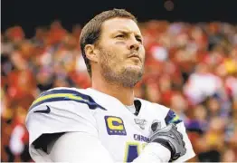  ?? CHARLIE RIEDEL AP ?? Quarterbac­k Philip Rivers ended his 16-year tenure with the Chargers on Saturday by signing the $25 million deal he agreed to with the Indianapol­is Colts last week.