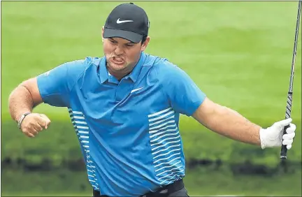  ??  ?? Patrick Reed celebrates his eagle on the 15th hole yesterday