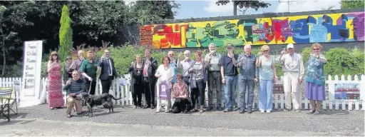  ??  ?? ●●The Friends of Reddish South Station raised a glass to Jo Cox’s memory and their refurbishe­d mural