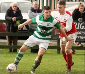  ??  ?? Eamonn O’Brien of Shamrock Rovers is tracked by Rory O’Connor of Moyne Rangers.