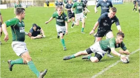  ??  ?? Crossing the line: Craig Chambers scores a try for Caithness