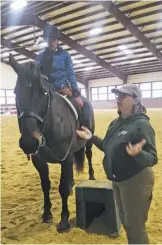  ??  ?? Equestrian­s worldwide are eager to learn from renown Flint Hill trainer Wendy Murdoch, including Carin Wahl, barn manager at High Meadow Manor, seen here in the saddle.