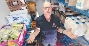  ?? Picture: GLENN FERGUSON ?? FOOD HEISTS: Major Vic Pitman-Jones, from the Salvation Army Northside Community Centre, in the fridge where goods were stolen earlier this year.