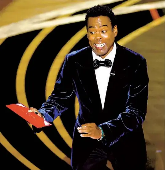  ?? LOS ANGELES TIMES ?? MYUNG CHUN Chris Rock speaks onstage during the 94th Academy Awards last year, briefly before being slapped by Will Smith.